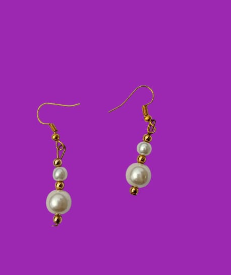 White pearl necklace and matching pearl drop earrings with gold hooks
